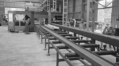 Akyapak CNC beam drill line — CYM Materiales Akyapak CNC beam drilling machine for structural steel processing, represented by CYM Materiales in Latin America